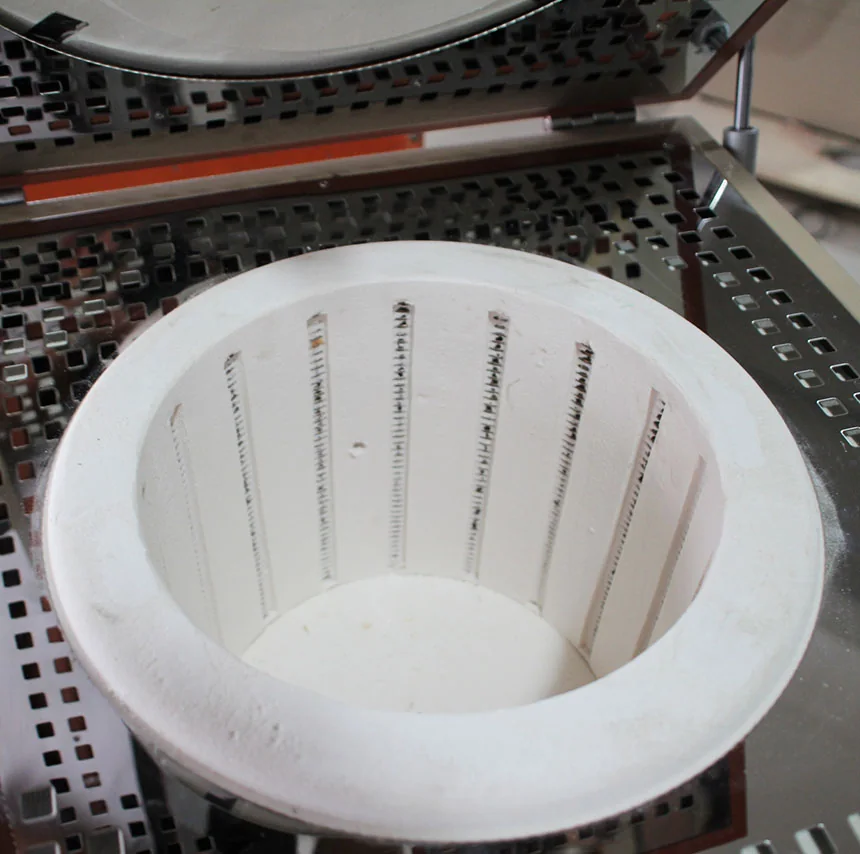 Close view of the insulated crucible furnace chamber and installed heating-element channels