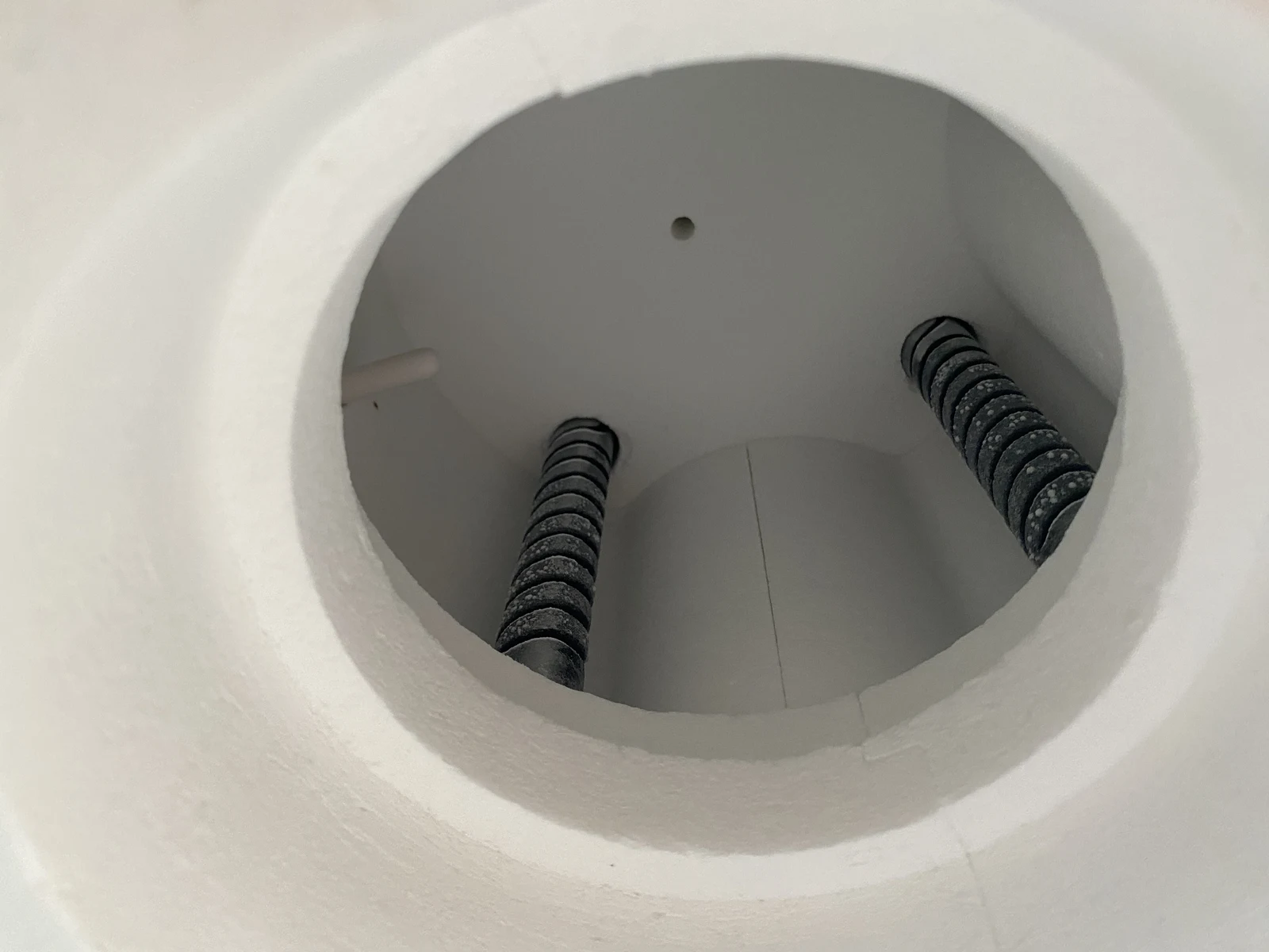 Interior of a dental porcelain furnace chamber with visible heating elements