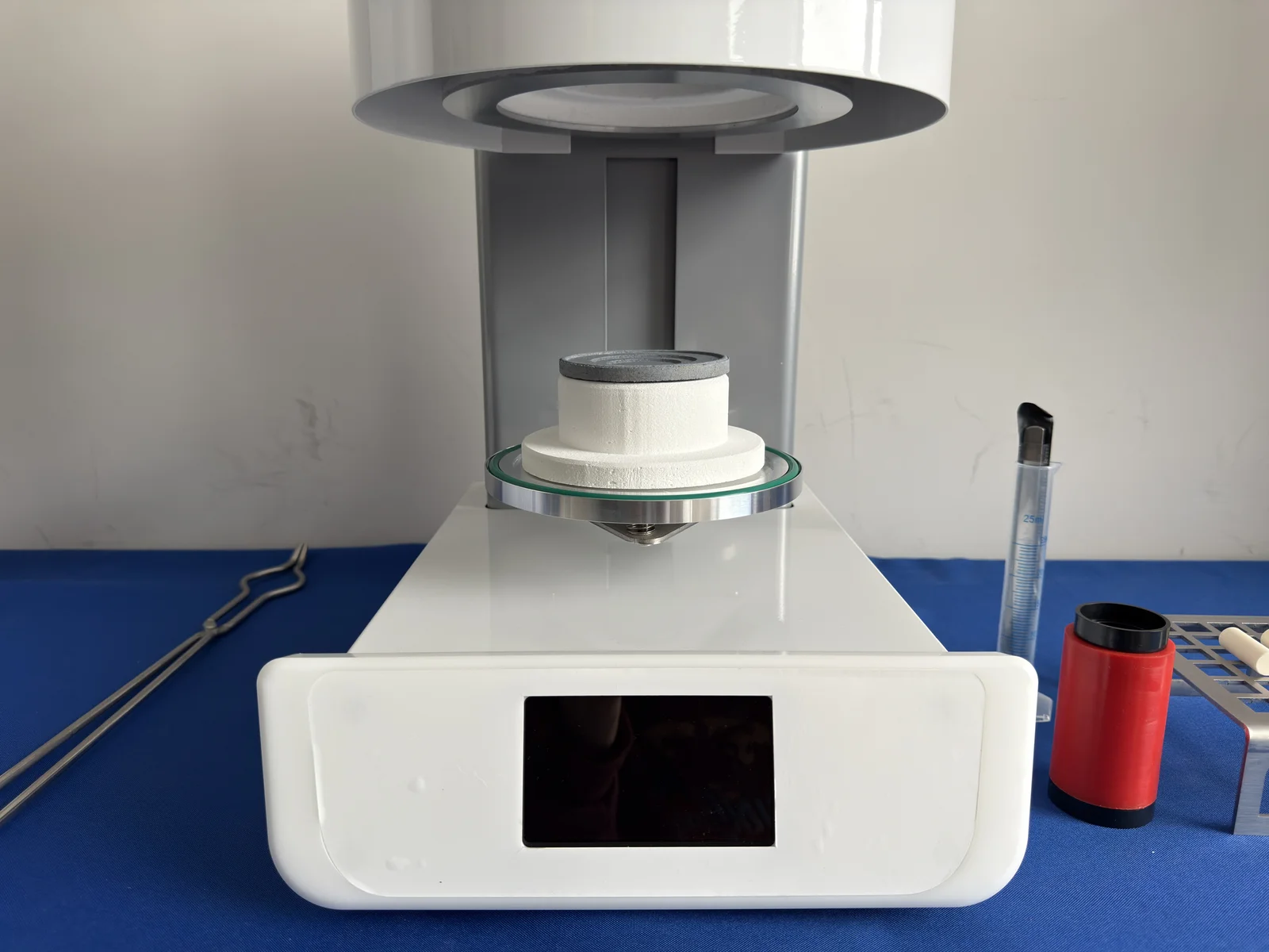 Dental press furnace lift platform with an investment-ring support positioned below the heated chamber