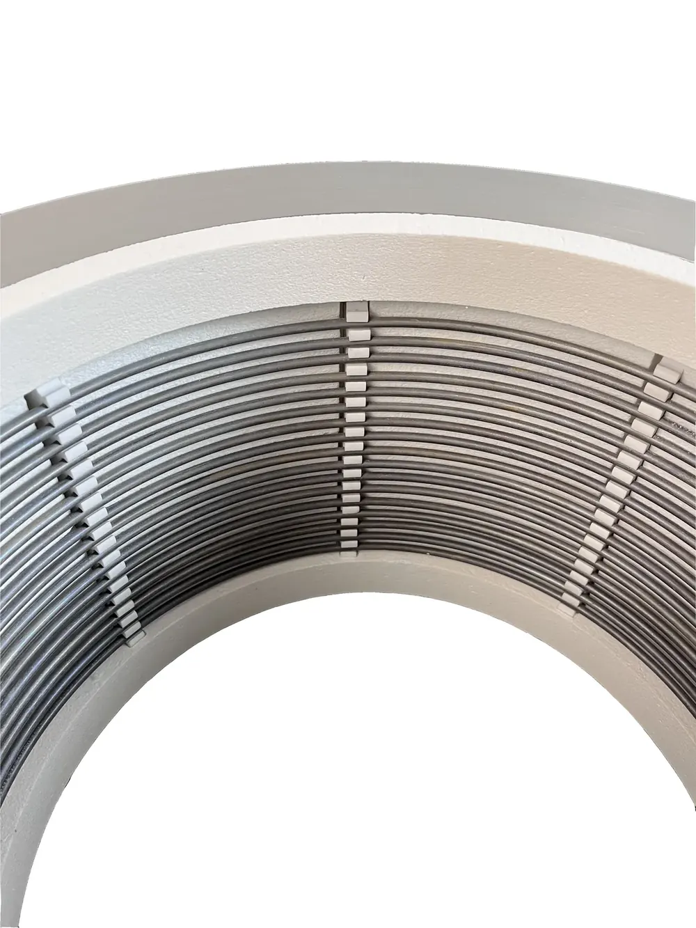 Close view of resistance heating wire installed inside a curved furnace chamber