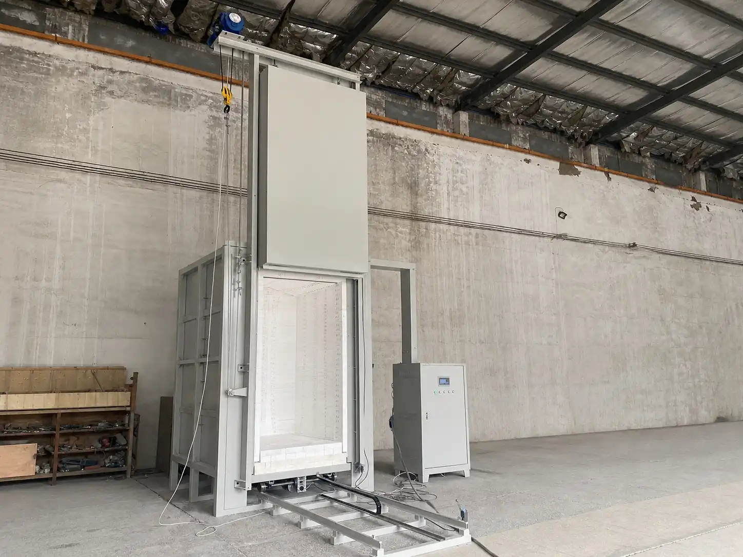 Complete trolley hearth furnace system illustrating load, chamber, controls and installation interfaces