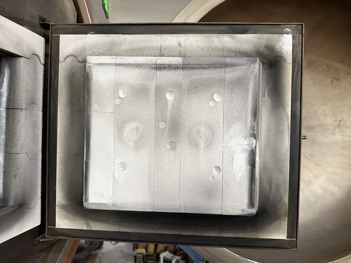 Insulated inner door assembly for a vacuum atmosphere box furnace