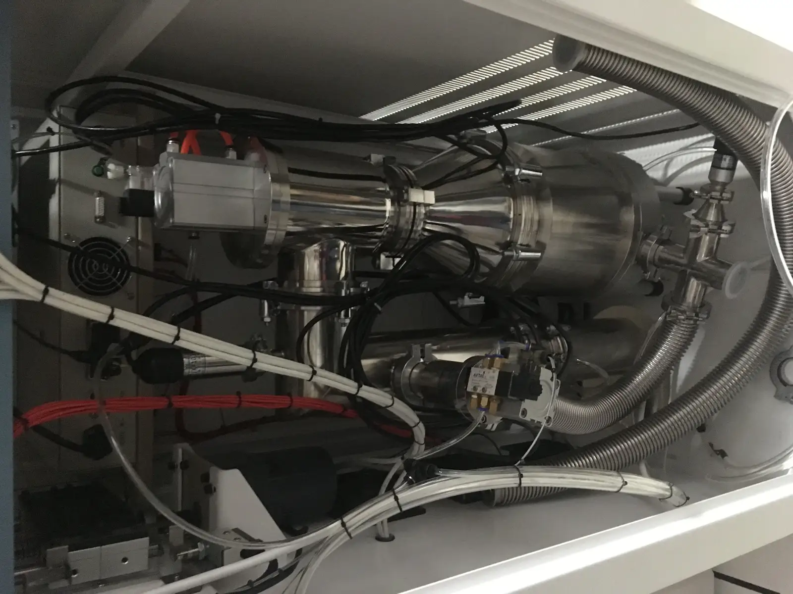 Vacuum piping, valves, gauges and pumping connections inside a brazing furnace system