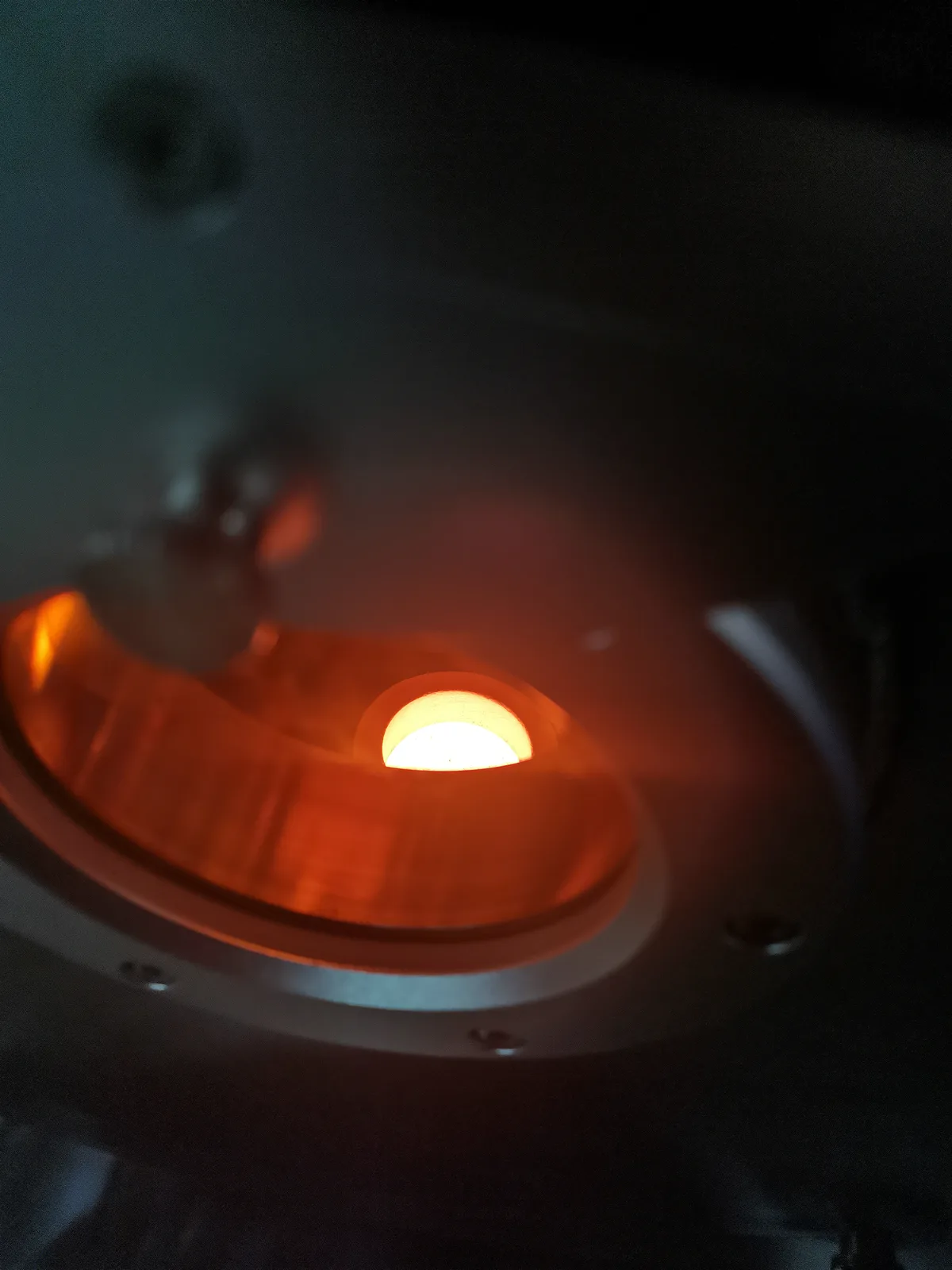 Heated crucible charge during an induction melting process trial