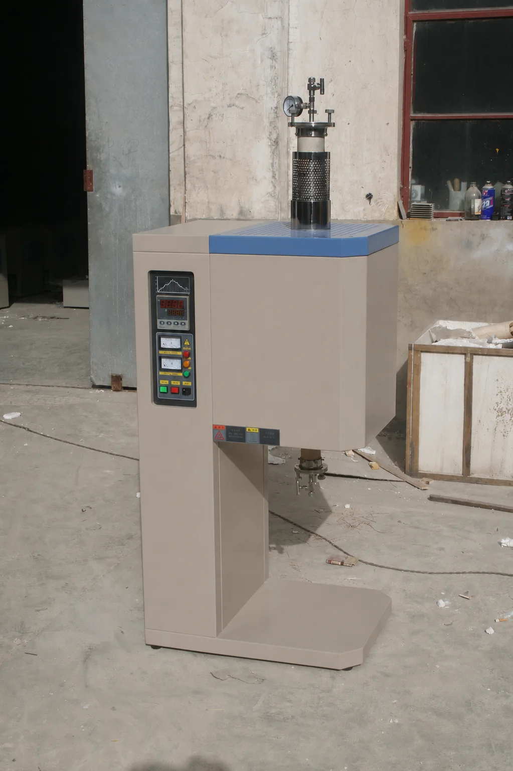 Fixed vertical tube furnace showing the complete support frame, upper and lower tube connections, controls and floor-standing base